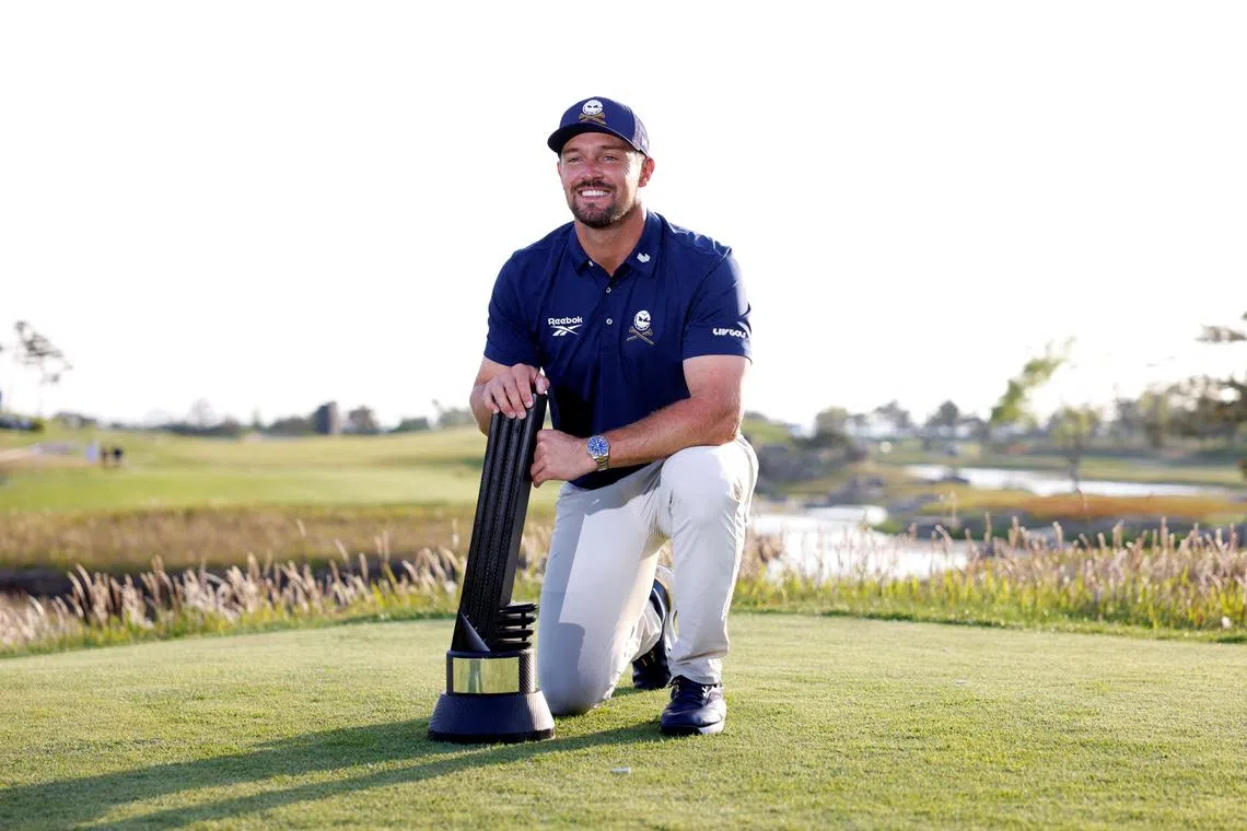 FILE PHOTO: Golf - LIV Golf - Korea - Jack Nicklaus Golf Course, Incheon, South Korea - May 4, 2025 Crushers GC's Bryson DeChambeau poses with the trophy and celebrates after winning the LIV Golf - Korea REUTERS/Kim Soo-Hyeon/File Photo