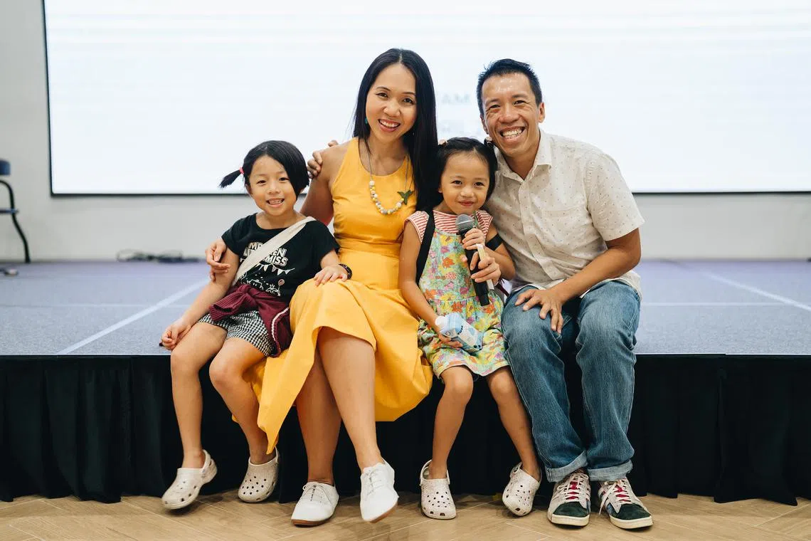 Mr Cliff Tam, founder of The Ordinary Dad community for stay-at-home fathers, with his wife Dr Tam Wai Jia and their daughters, Sarah-Faith (left) and Esther-Praise.


Credit: Photo by Joash Lee