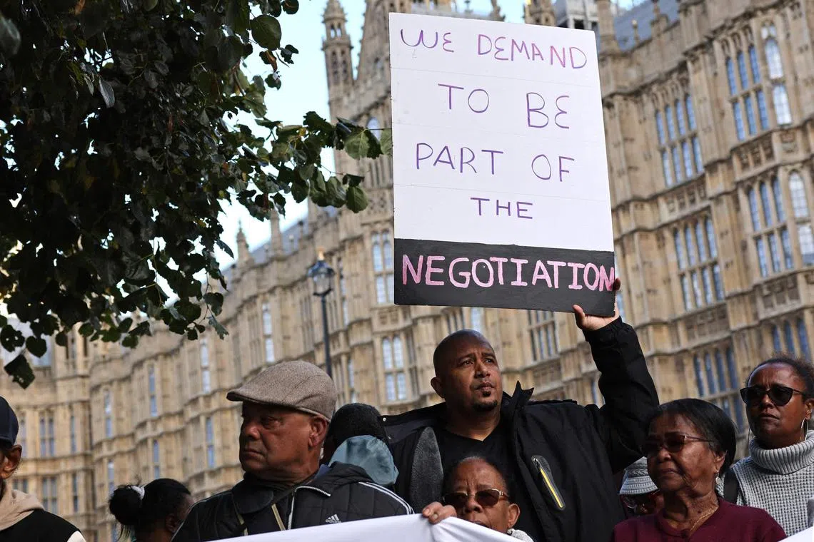 Members of the Chagossian community protesting outside the British Parliament in October 2024, over the UK government's decision to cede sovereignty of the strategic Chagos Islands to Mauritius.