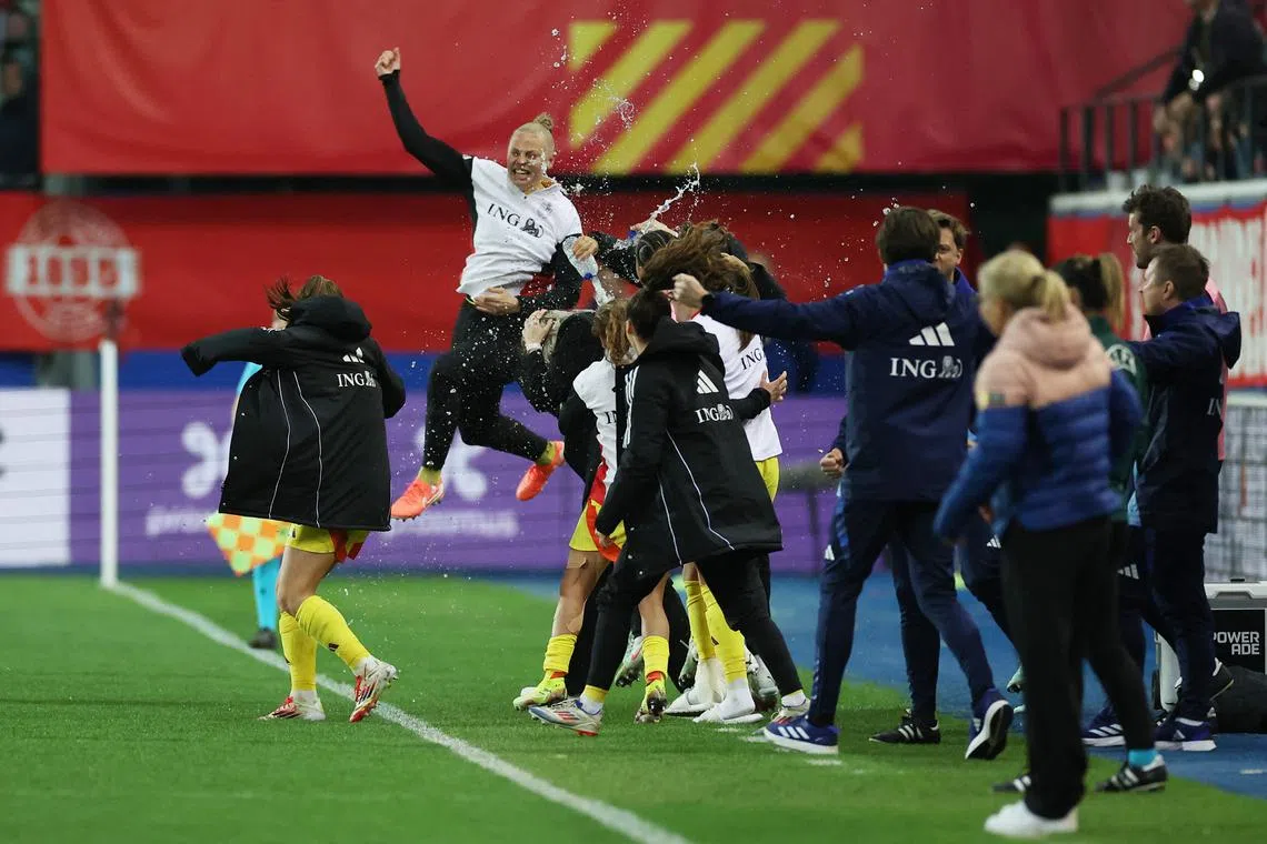 FILE PHOTO: Soccer Football - Women's Nations League - League A - Belgium v England - Den Dreef, Leuven, Belgium - April 8, 2025 Belgium players celebrate after the match REUTERS/Yves Herman/File Photo