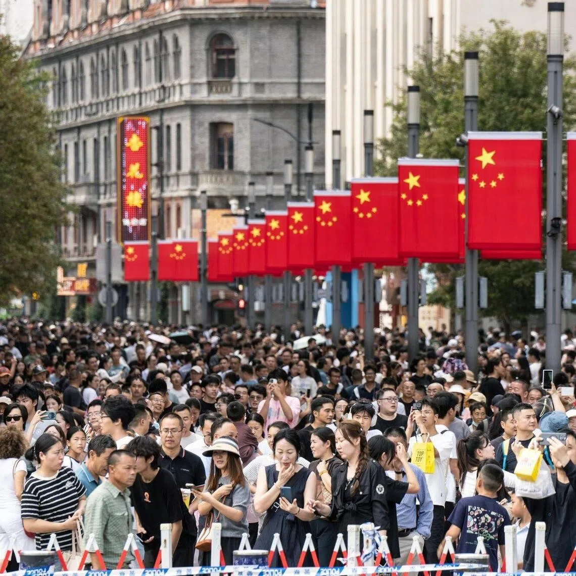 Pedestrians in the Nanjing Road shopping area during the Golden Week holiday in Shanghai, China, on  Oct. 2, 2025.