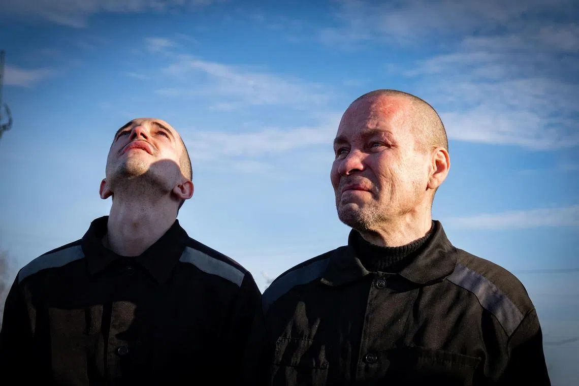 A January 2024 photo shows Ukrainian prisoners of war after returning home as part of a POW swop, amid Russia's invasion of Ukraine.