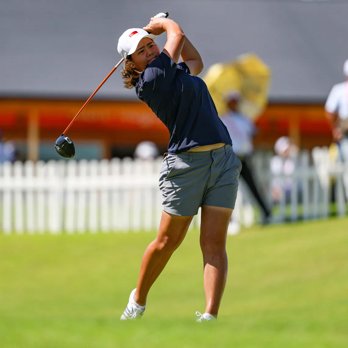 Shannon Tan maintained her place at the top of the leaderboard at the Asian Games after carding a six-under 64 in the second round on Oct 1.
