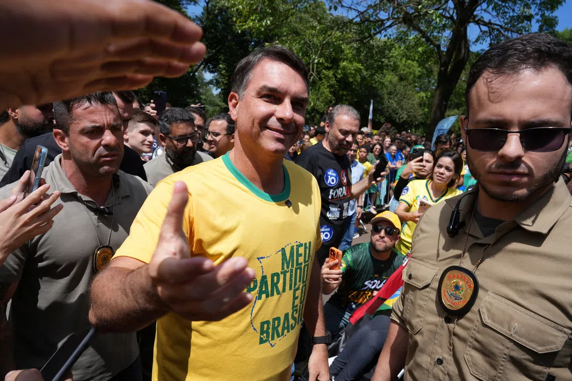 Brazil’s Flavio Bolsonaro beats polls in presidential vote, faces incumbent Lula in runoff