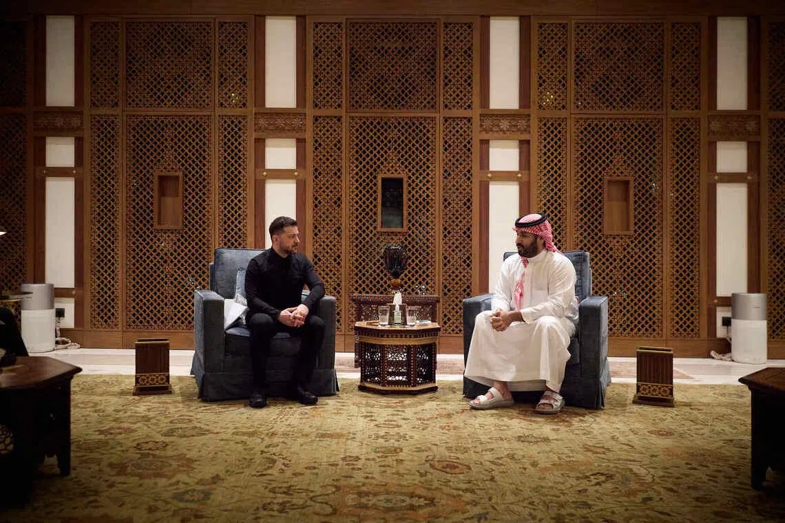 Ukrainian President Volodymyr Zelensky (left) meeting Saudi Crown Prince  Mohammed bin Salman, in a photo from Mr Zelensky's X account.