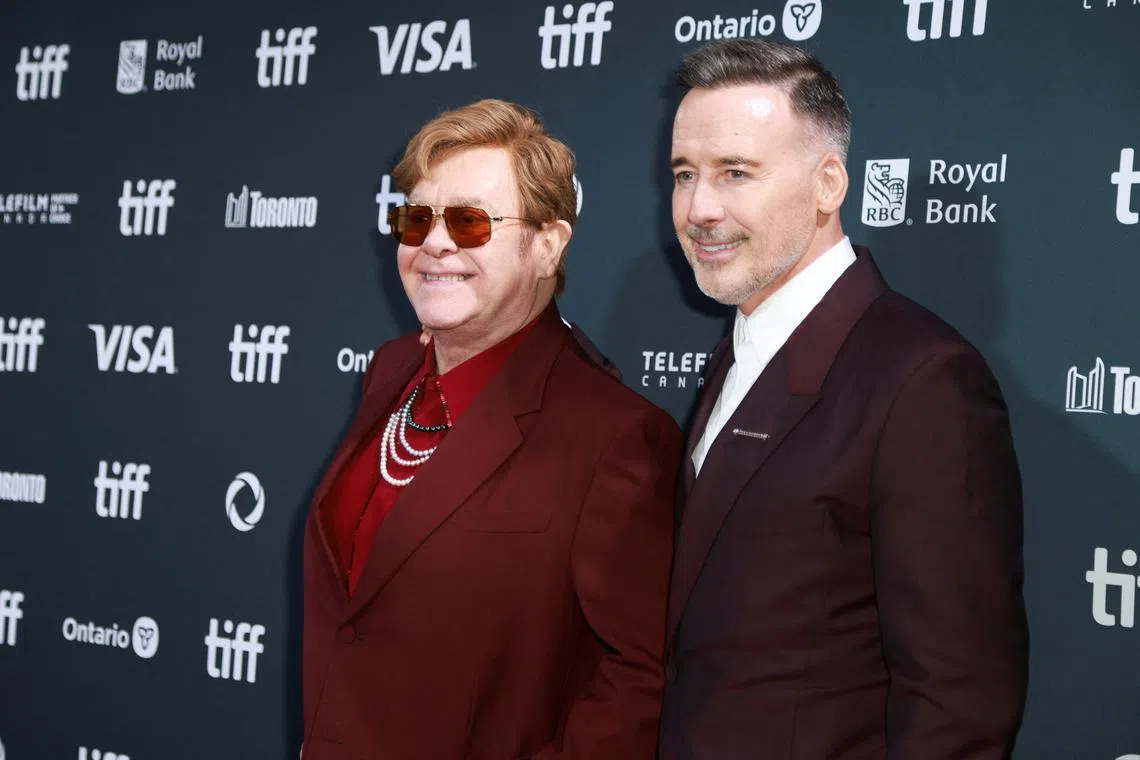 British singer Elton John (left) and his husband David Furnish at the Toronto International Film Festival in September.