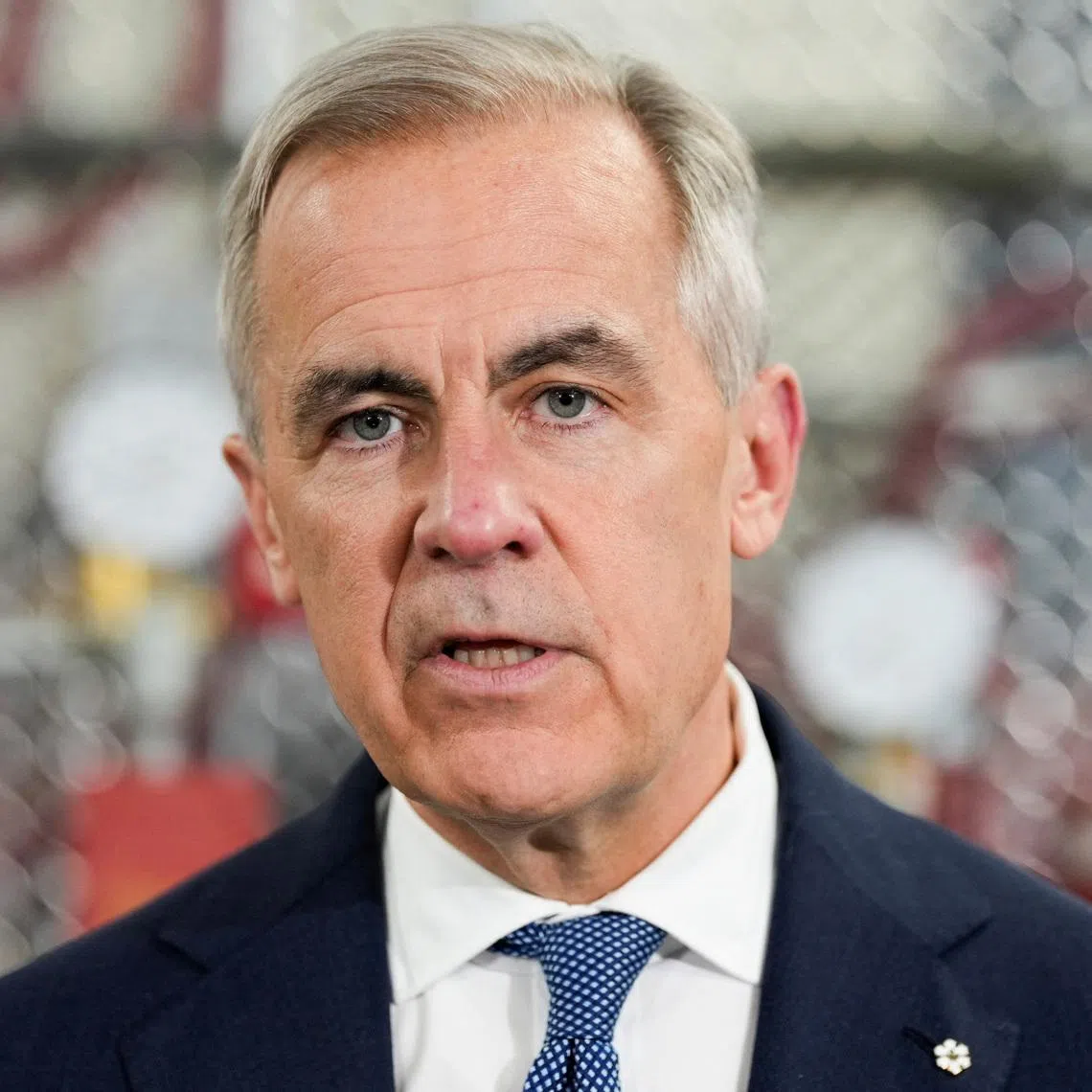 Canada's Prime Minister Mark Carney speaks as he meets unionized skilled trades workers at the United Association of Journeymen and Apprentices of the Plumbing and Pipefitting Industry of the United States and Canada (UA) office in Calgary, Alberta, Canada, May 15, 2026.  REUTERS/Todd Korol