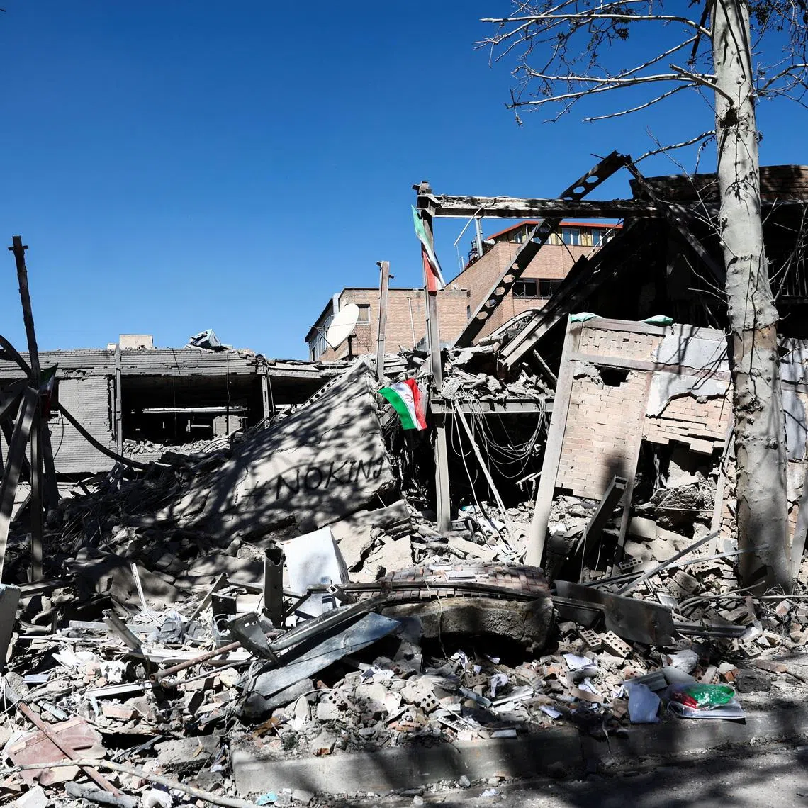 An Iranian flag lies amidst the rubble of a building of the Sharif University of Technology, which was damaged in a strike, amid the U.S.-Israeli conflict with Iran, in Tehran, Iran, April 7, 2026. Majid Asgaripour/WANA (West Asia News Agency) via REUTERS