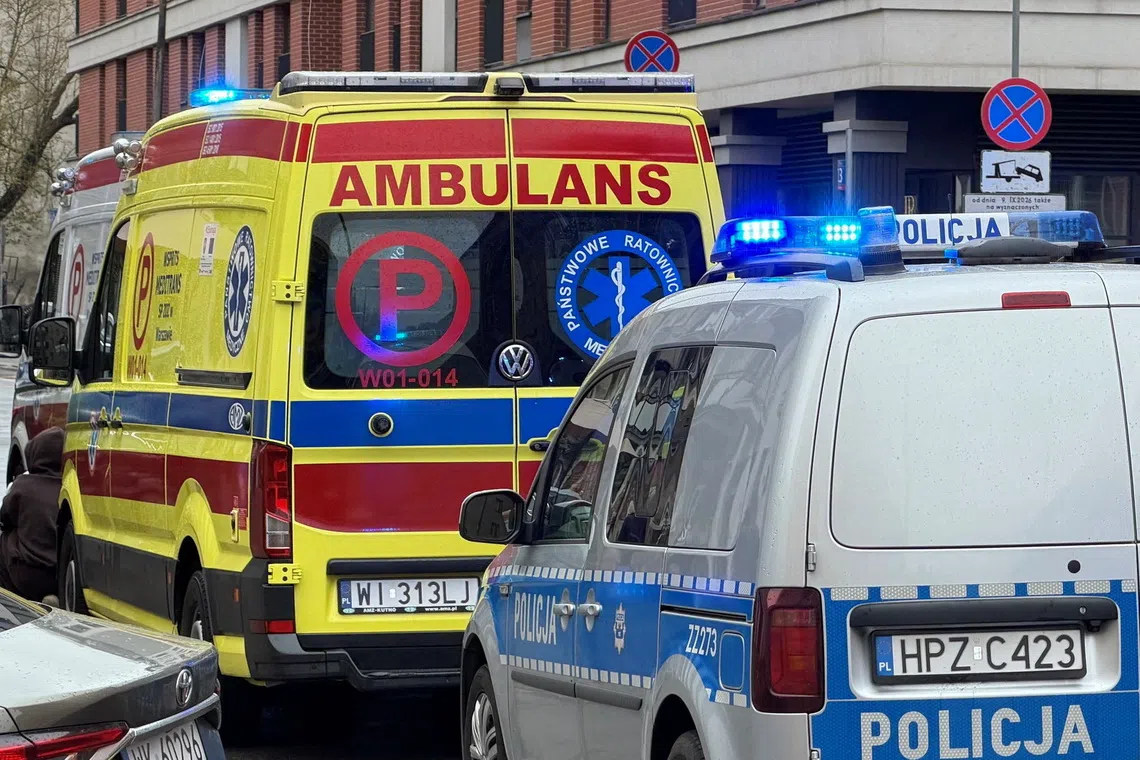 Ambulances stand outside a TEB Edukacja post-secondary school building following a knife attack on Minska Street in Warsaw, Poland, October 10, 2026. Dariusz Borowicz/Agencja Wyborcza.pl via REUTERS ATTENTION EDITORS - THIS IMAGE WAS PROVIDED BY A THIRD PARTY. POLAND OUT. NO COMMERCIAL OR EDITORIAL SALES IN POLAND.
