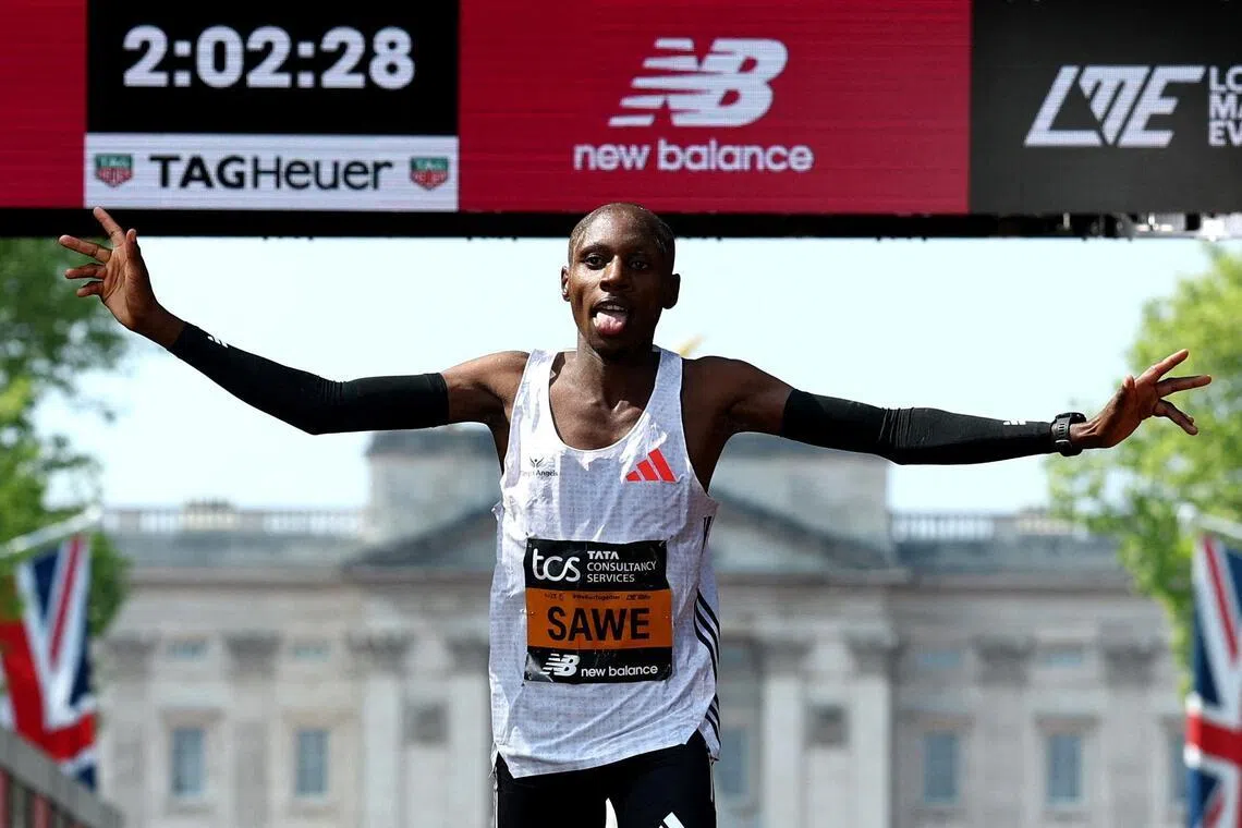 Kenya's Sabastian Sawe crossing the finish line to win the London Marathon men's elite race in 2025.