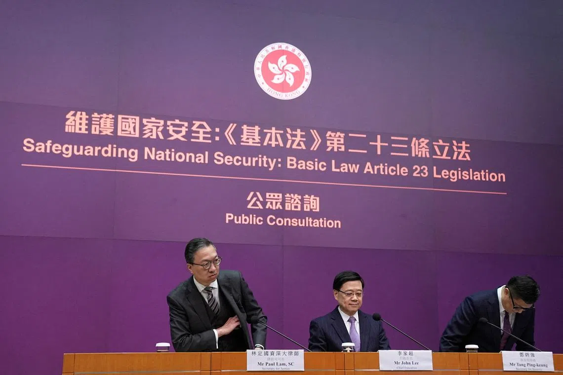 FILE PHOTO: Hong Kong's Secretary for Justice Paul Lam, Chief Executive John Lee and Secretary for Security Chris Tang Ping-keung attend a press conference regarding the legislation of Article 23 national security laws, in Hong Kong, China January 30, 2024. REUTERS/Lam Yik/File Photo