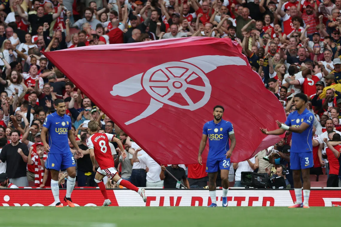 Soccer Football - Premier League - Arsenal v Chelsea - Emirates Stadium, London, Britain - September 6, 2026 Arsenal's Martin Odegaard celebrates scoring their second goal as Chelsea players look dejected Action Images via Reuters/Paul Childs