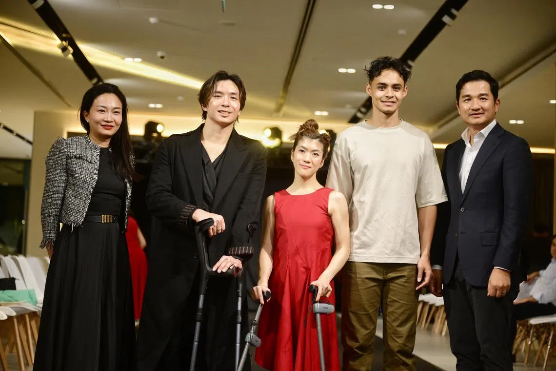 Para swimmer Toh Wei Soong (second from left) during his debut as a creative director at a fashion runway with (from left) Ms Magdelene Tan, marketing director of Inchcape Singapore, para equestrienne Gemma Foo, para long jumper Suhairi Suhani, and Mr Eric Tong, sales and distribution director of Inchcape Singapore, on Dec 12, 2024.

ST PHOTO: AZMI ATHNI