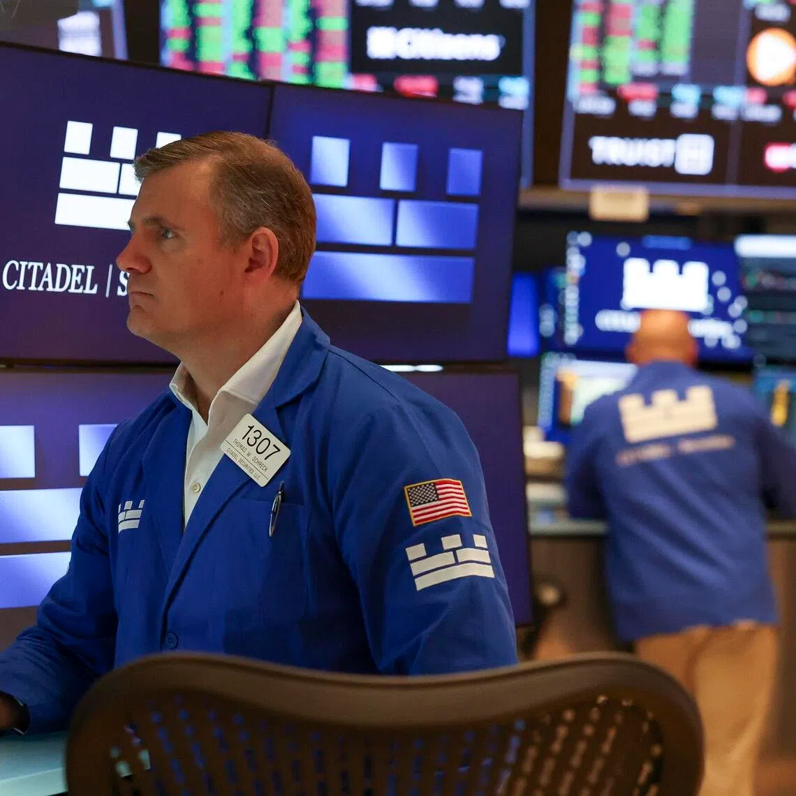 Traders working on the floor of the New York Stock Exchange,  during morning trading on Aug 21.
