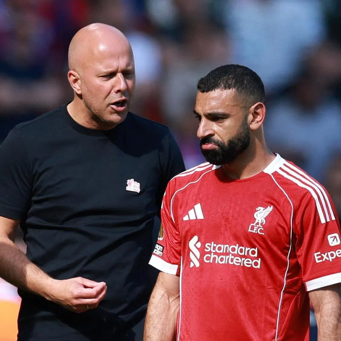 Liverpool manager Arne Slot with Mohamed Salah during a Premier League match against Crystal Palace.