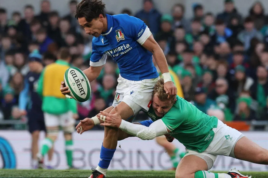 Italy's Ange Capuozzo battling with Ireland's Craig Casey in their Six Nations clash.