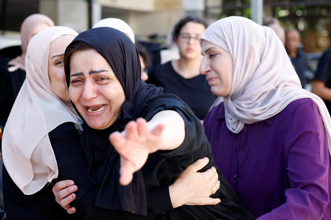 Mourners react during a funeral of a Palestinian who was killed by Israeli forces, in Ramallah, in the Israeli-occupied West Bank July 16, 2024. REUTERS/Mohammed Torokman