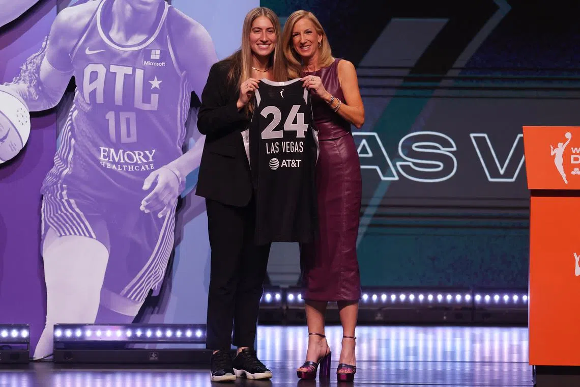 Apr 15, 2024; Brooklyn, NY, USA; Kate Martin poses with WNBA commissioner Cathy Engelbert after being selected with the number eighteen overall pick to the Las Vegas Aces in the 2024 WNBA Draft at Brooklyn Academy of Music. Brad Penner-USA TODAY Sports/File Photo