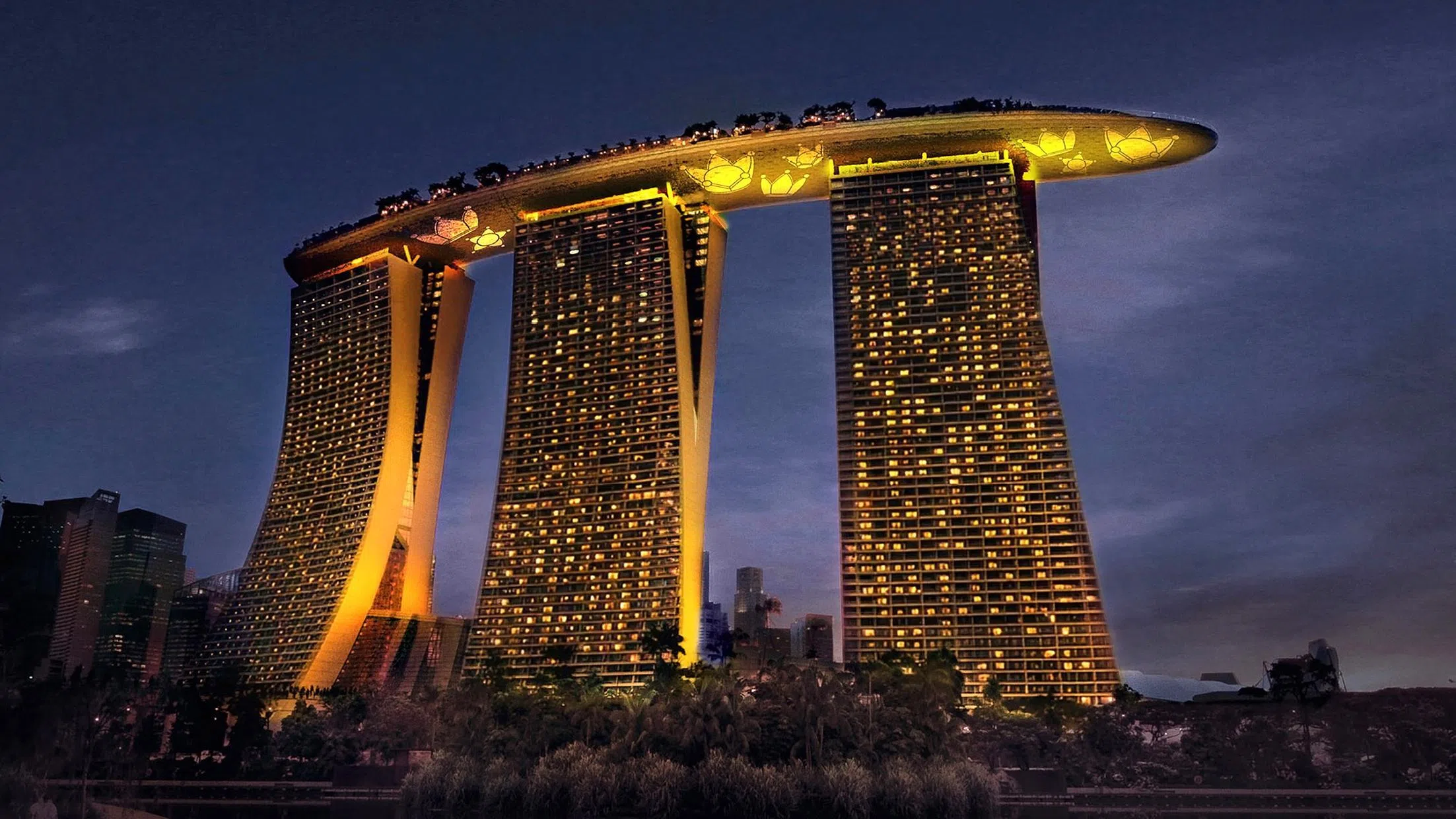 Marina Bay Sands’ three hotel towers and the ArtScience Museum facade will be lit up in BigBang’ssignature yellow, and also display the group’s lotus crown logo.
