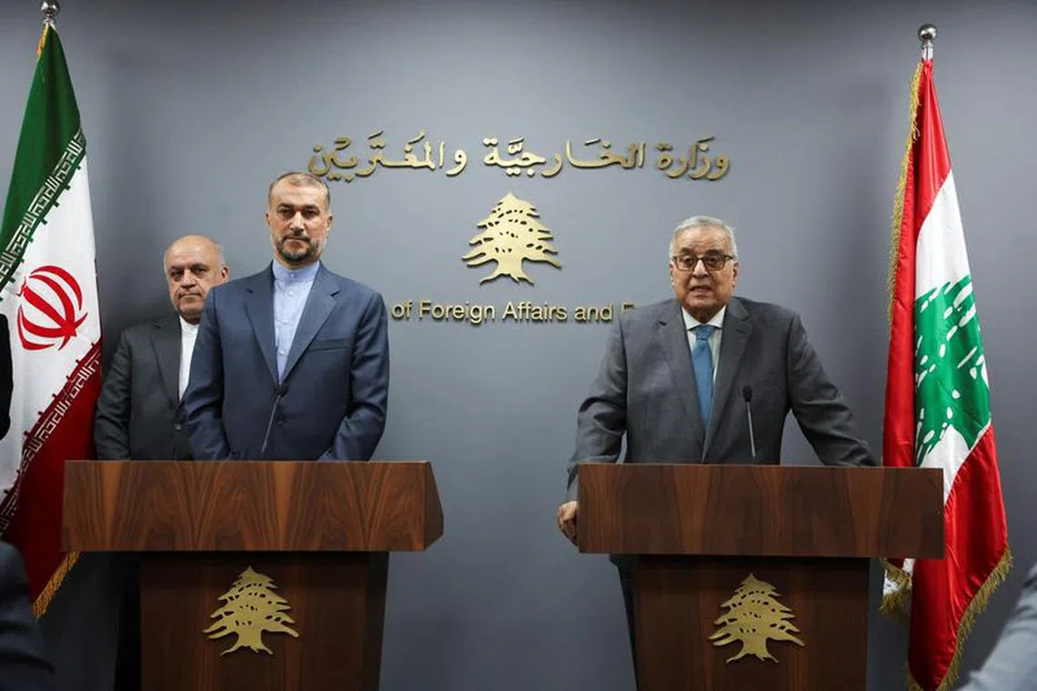 Lebanon's caretaker Foreign Minister Abdallah Bou Habib and Iranian Foreign Minister Hossein Amirabdollahian attend a joint press conference in Beirut, Lebanon October 13, 2023. REUTERS/Mohamed Azakir