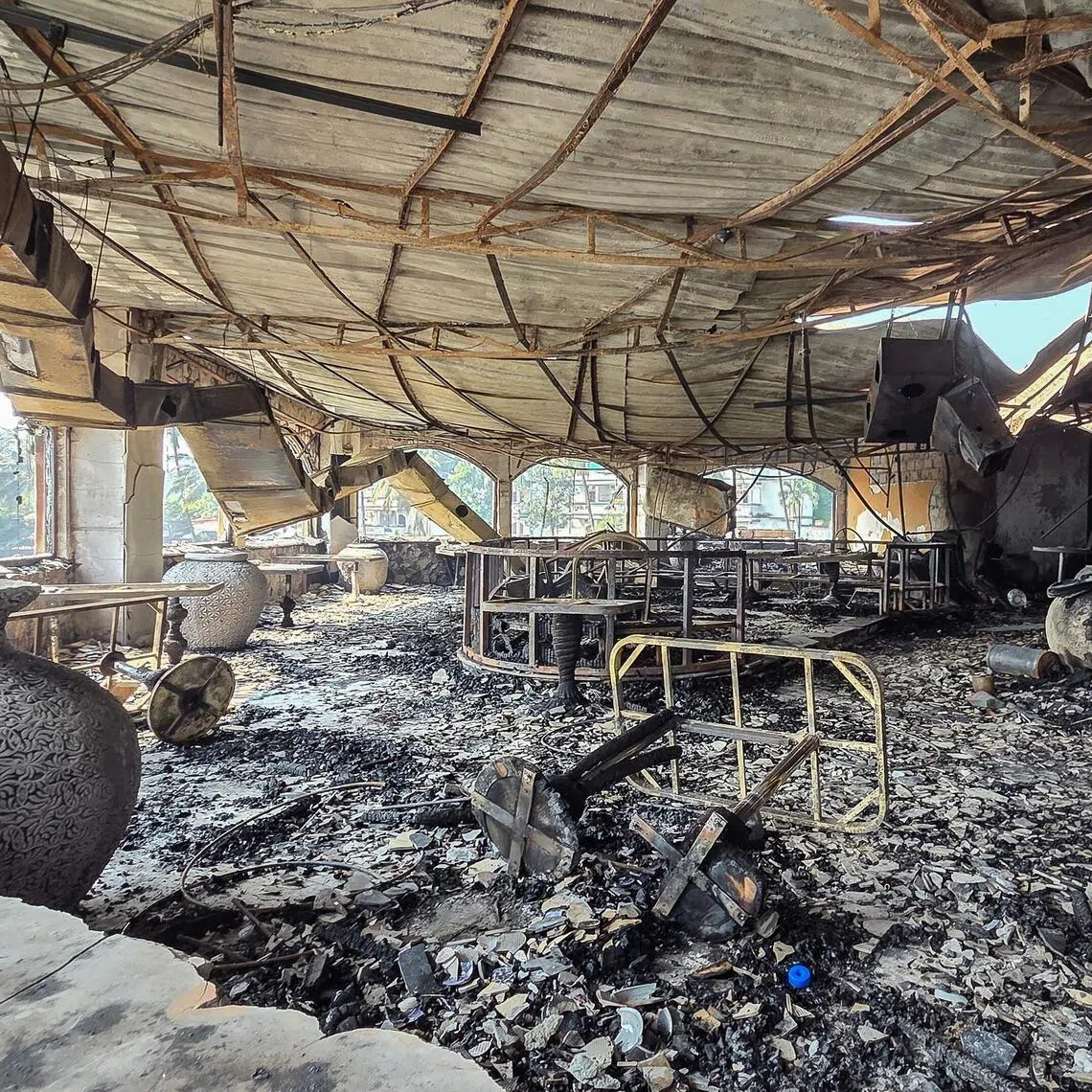 A burned-out interior is seen inside the Birch nightclub in Goa following a fire that broke out and killed 25 people.