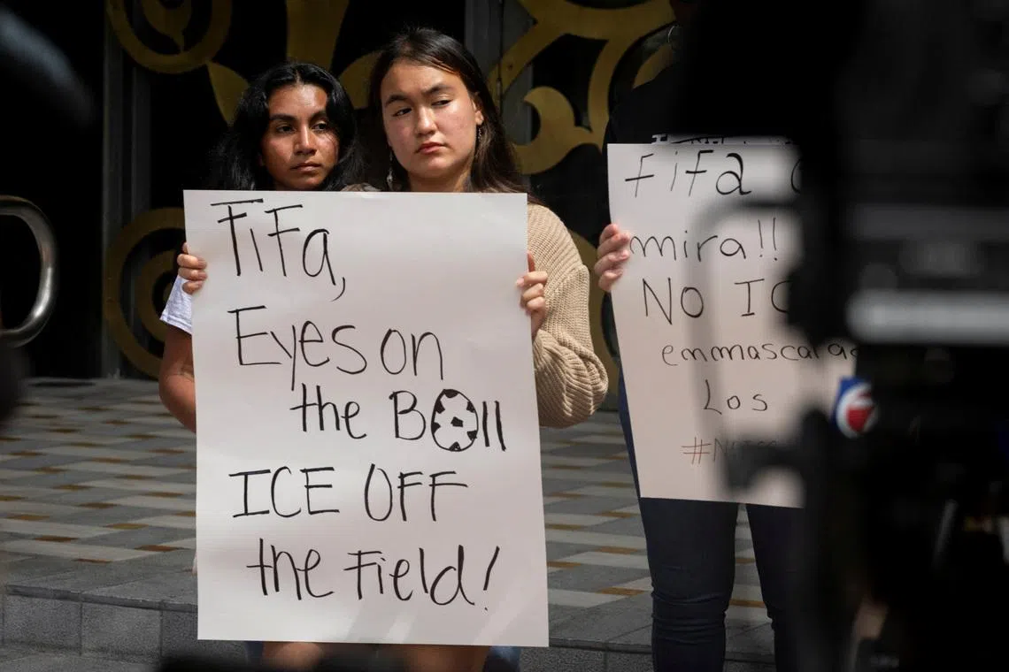 Immigration advocates gather outside FIFA's offices to demand that the organization bans ICE and CBP presence at upcoming World Cup events, in Coral Gables, Florida, U.S., June 30, 2025. REUTERS/Marco Bello/File Photo