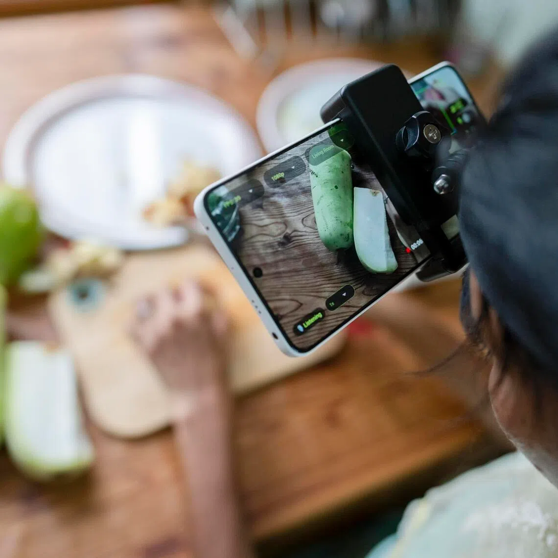 Humans help train artificial intelligence to better perform tasks like chopping vegetables.