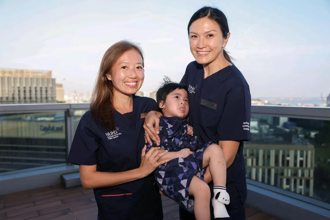 Paediatric neurologist Furene Wang (left) and geneticist Chin Hui-Lin from NUH with Oliver Soh, who has primary co-enzyme Q10 deficiency, a rare inherited disorder caused by mutations in the COQ4 gene.