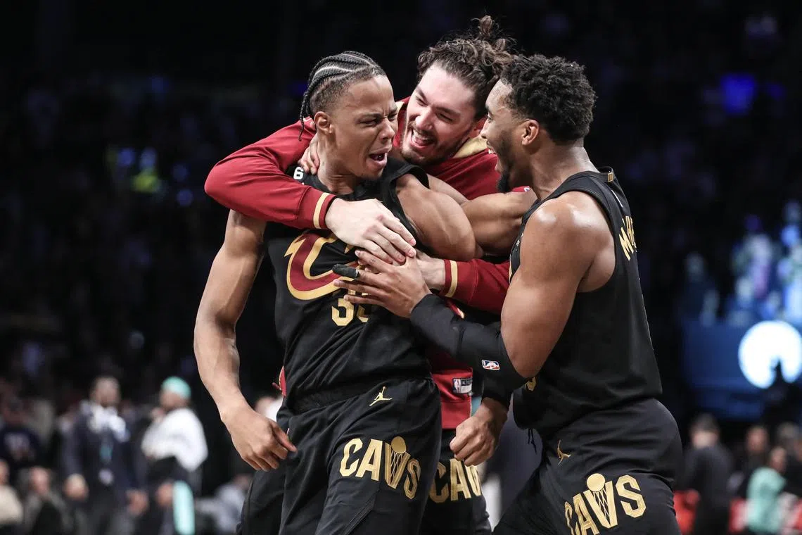 Cleveland Cavaliers forward Isaac Okoro (No. 35) celebrating with his teammates after scoring the game-wining basket to beat the Brooklyn Nets 116-114 at Barclays Centre.