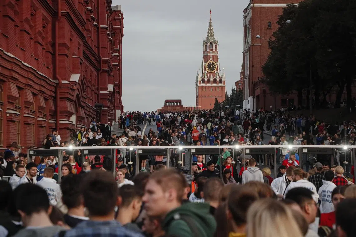 People gather at Red Square for a rally to mark the one-year anniversary of Russia's annexation in Moscow, Russia, on Sept 29.