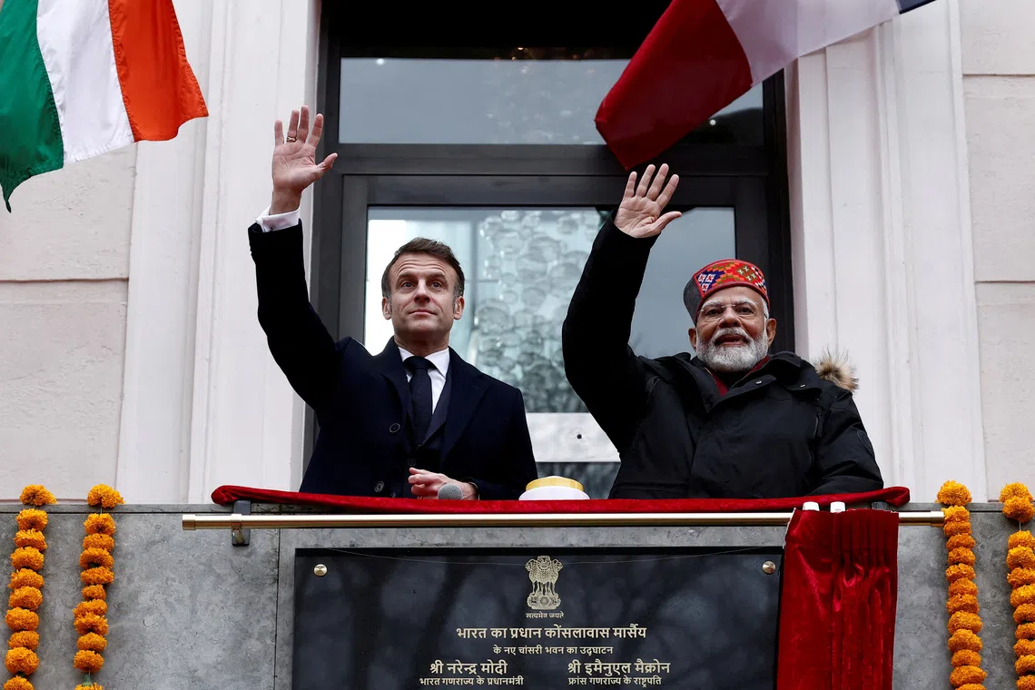FILE PHOTO: French President Emmanuel Macron and Indian Prime Minister Narendra Modi wave from the balcony during the inauguration of the Indian Consulate as part of a visit in Marseille, France, February 12, 2025.  REUTERS/Christian Hartmann/Pool/File Photo
