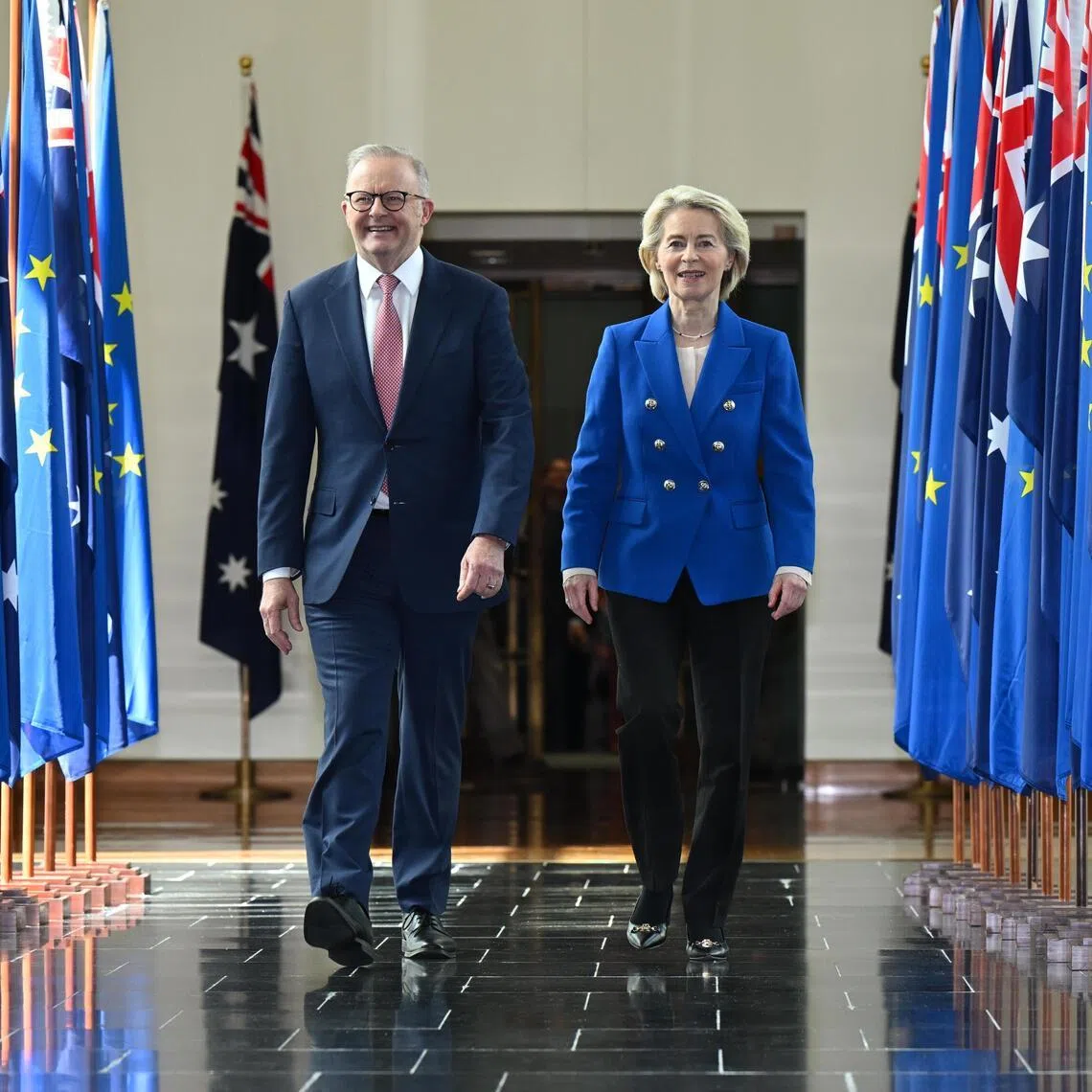 epa12845219 Australian Prime Minister Anthony Albanese and President of the European Commission Ursula von der Leyen walk together after addressing members and senators during a joint sitting in the House of Representatives at Parliament House in Canberra, Australia, 24 March 2026.  EPA/LUKAS COCH AUSTRALIA AND NEW ZEALAND OUT