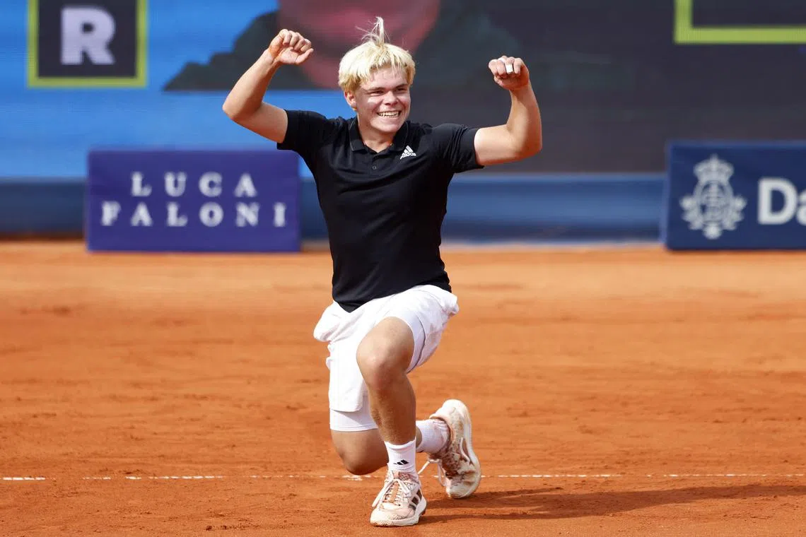 Germany's Diego Dedura-Palomero celebrates after Canada's Denis Shapovalov retires from his round of 32 match at the Munich Open.