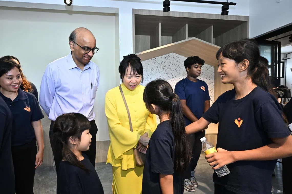 ST20240530-202433273593-Lim Yaohui-Syarafana Muhammad Shafeeq-sschallenge30/
Nur Qamarina Muhammad Rhyme, (extreme right) 11, Primary 5, and Lim Kai Tong Zoey, (bottom left) 7, Primary 1, interacting with President Tharman Shanmugaratnam, accompanied by his wife Ms Jane Ittogi, engaging CampusImpact beneficiaries during the launch of the President's Challenge 2024 (PC 2024) at CampusImpact on May 30, 2024.
The President's Challenge is an annual campaign, led by the President, to raise funds for ­­benefitting agencies to support disadvantaged communities.
(ST PHOTO: LIM YAOHUI)