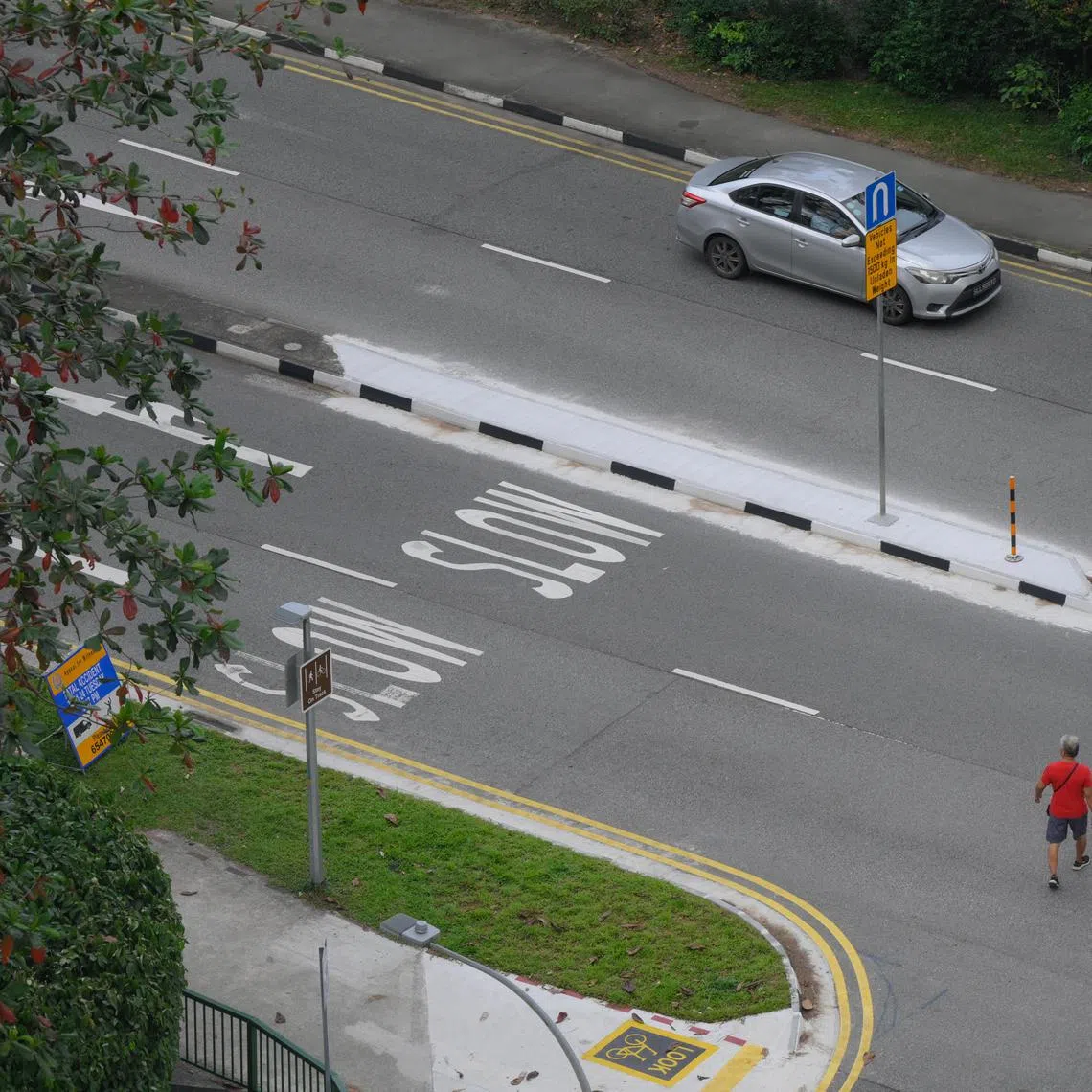People jay walk across Yuan Ching Road, near the site where a 12-year-old girl was killed after being hit by a van on Jan 30, pictured on Feb 6, 2024.