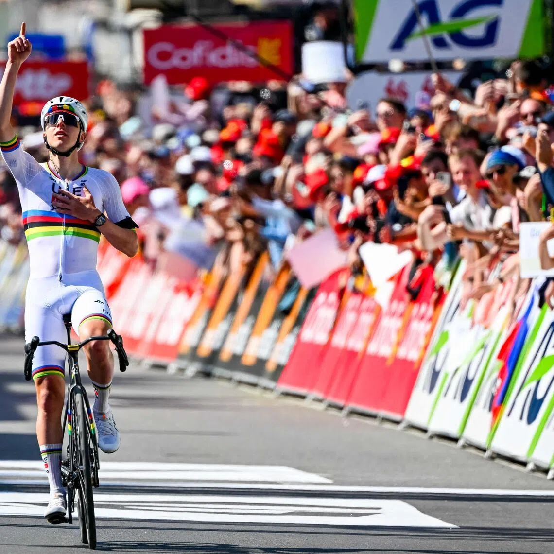 UAE Team Emirates-XRG's Slovenian rider Tadej Pogacar celebrates as he crosses the finish line in the men's elite race of the Liege-Bastogne-Liege UCI World Tour one-day cycling race, on April 26, 2026.
