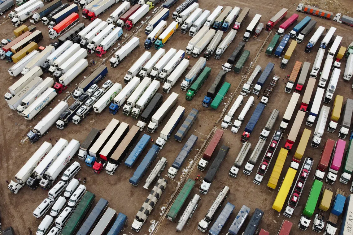 FILE PHOTO: A drone view shows parked trucks as truckers wait for the Cristo Redentor border crossing between Argentina and Chile to reopen after heavy snowfall forced its closure, in Uspallata, Mendoza province, Argentina, July 22, 2026. REUTERS/Maximiliano Rios/File Photo