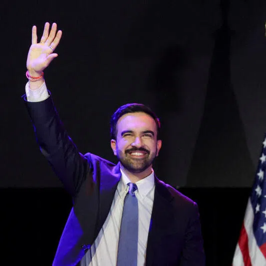 Democratic candidate Zohran Mamdani waving to supporters at a rally after winning the 2025 New York City mayoral race on Nov 4. 