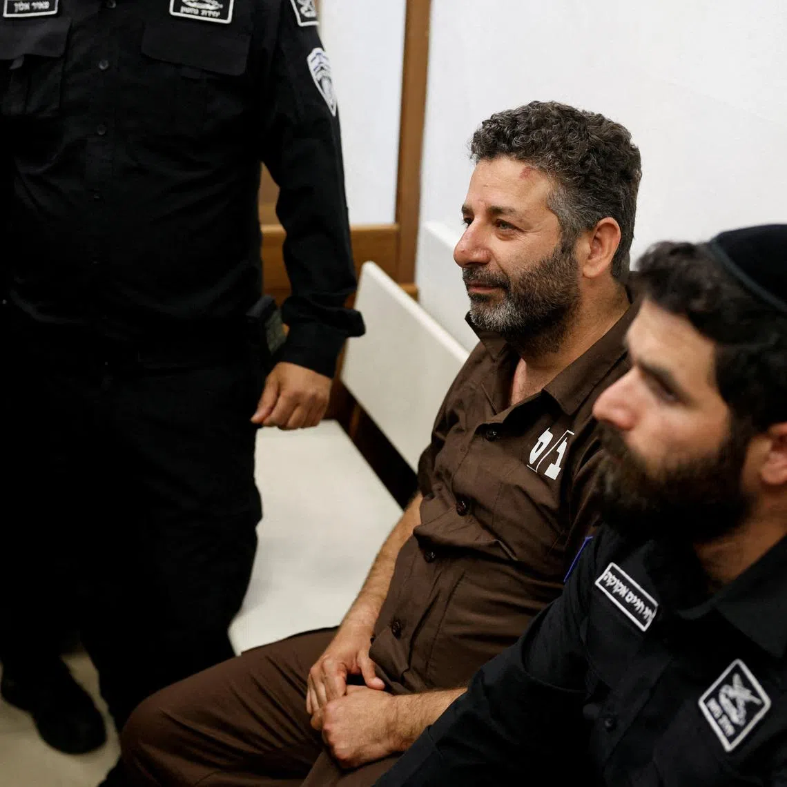 Activist Saif Abu Keshek sits at a magistrate's court for a detention extension hearing in Ashkelon, southern Israel, on May 3.