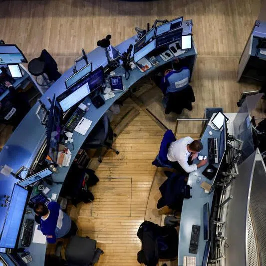 Traders work on the floor at the New York Stock Exchange in New York City, on March 9.