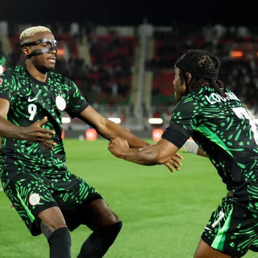 Nigeria's Victor Osimhen celebrates scoring their third goal with Ademola Lookman.