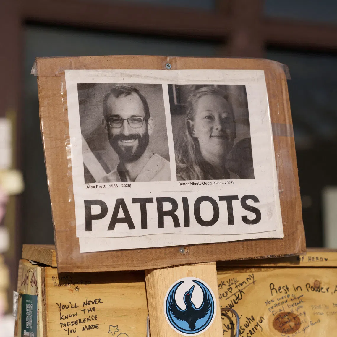 A sign honouring Alex Pretti and Renee Good at a memorial in Minneapolis, Minnesota, on March 12.
