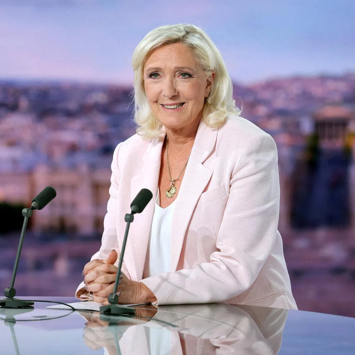 FILE PHOTO: French far-right leader Marine Le Pen, member of parliament for the Rassemblement National (National Rally - RN) party, poses prior to an interview on the evening news broadcast of French TV channel TF1, following the verdict in her appeal trial over misuse of EU funds, in Boulogne-Billancourt, near Paris, France, July 7, 2026. REUTERS/Christian Hartmann/Pool/File Photo