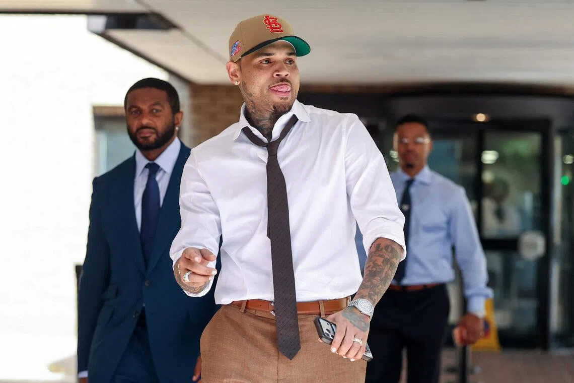 U.S. singer Chris Brown, who has been charged with inflicting grievous bodily harm in what prosecutors said was an "unprovoked attack" in a London nightclub in 2023, leaves Southwark Crown Court in London, Britain, July 24, 2026. REUTERS/Toby Melville