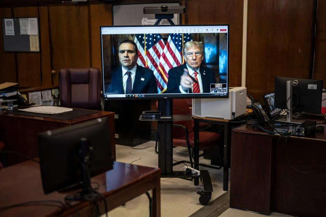 Attorney Todd Blanche (left) and US President-elect Donald Trump appearing in court via video link for the sentencing hearing on Jan 10. PHOTO: AFP