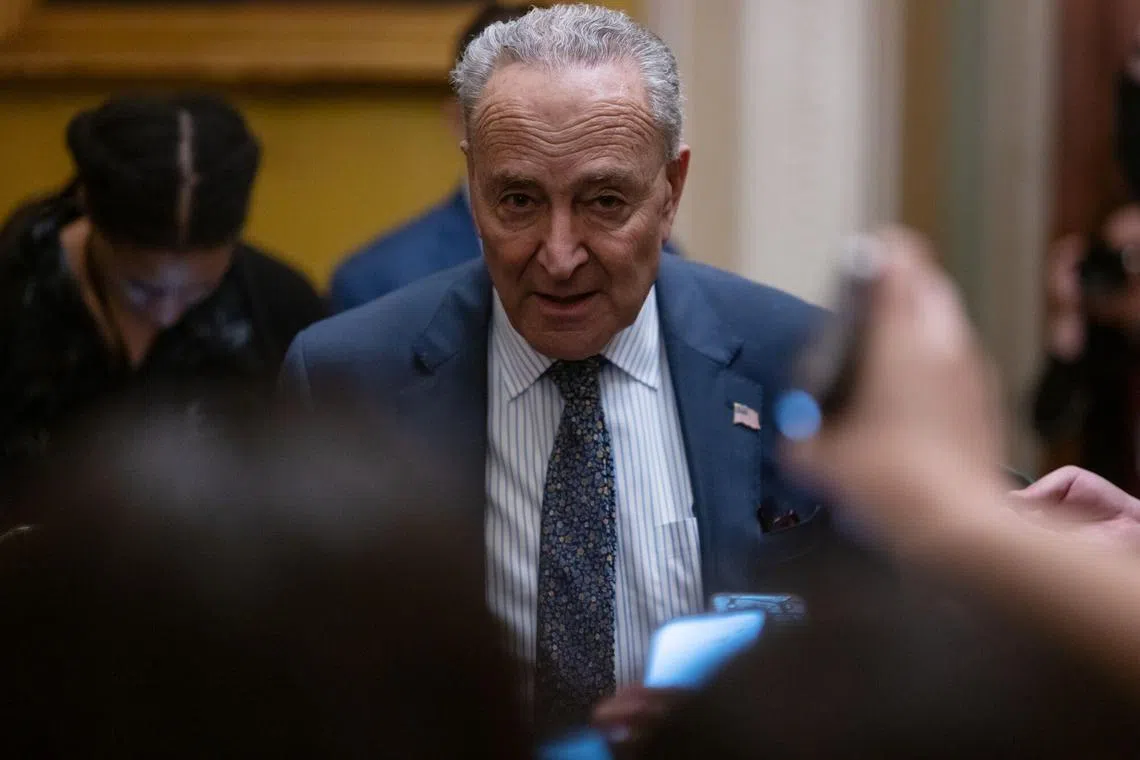 Senate Majority Leader Chuck Schumer, a Democrat from New York, center, speaks to members of the media at the US Capitol in Washington, DC, US, on Tuesday, Feb. 27, 2024. President Joe Biden on Tuesday stressed the urgency of passing a spending bill to keep agencies open past the March 1 deadline and prodded leaders to approve his request for tens of billions of dollars for Ukraine, Israel and the US-Mexico border, saying the consequences of inaction are "dire." Photographer: Craig Hudson/Bloomberg