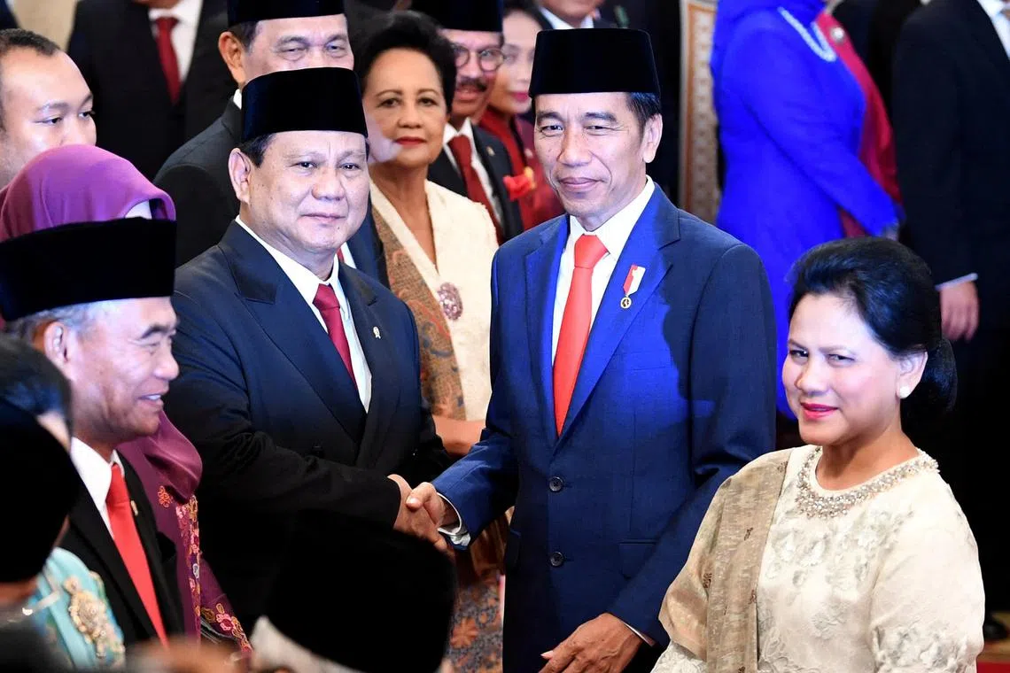 Mr Joko Widodo (right) congratulating Mr Prabowo Subianto after the latter was sworn in as defence minister on Oct 23, 2019.