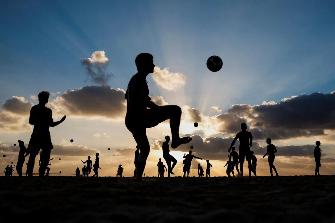 People enjoying the beach in Tel Aviv, Israel on Sept 2, 2025. 