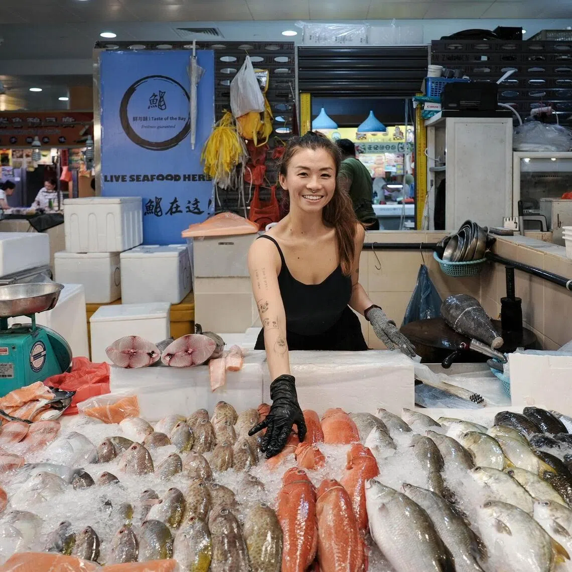 Former dental assistant Ms Neo Hui Qin became a fishmonger in 2024 and runs a stall in Tiong Bahru Market.