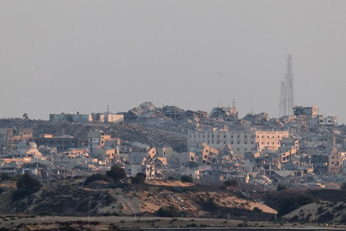 FILE PHOTO: Building lie in ruin in Gaza, as seen from the Israeli side of the border with Gaza, September 9, 2025. REUTERS/Amir Cohen/File Photo